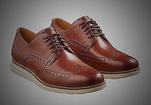Burgundy wingtip Oxford shoes with light-colored jeans