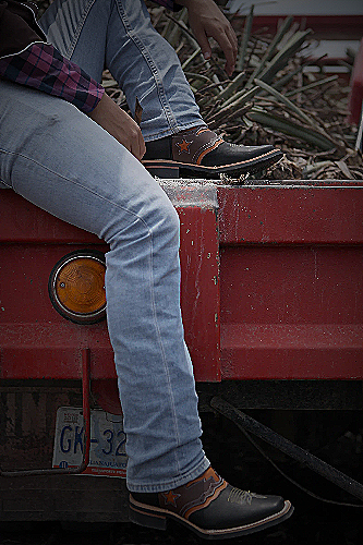 Image of cowboy boots and jeans