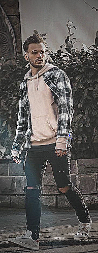 Alt Text: Plaid shirt over hoodie outfit