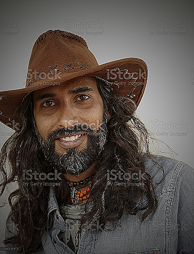 Stylish man wearing long hair cowboy hat