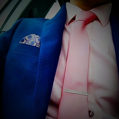 Accessories for blue suit and pink shirt