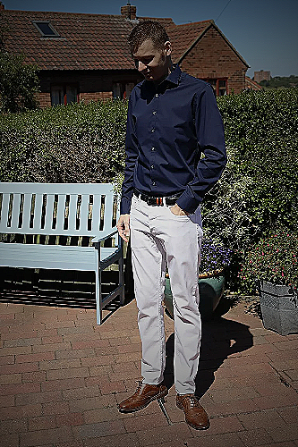 White jeans with navy blue shirt