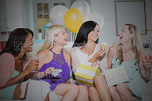 A group of smiling women at a baby shower - do men attend baby showers