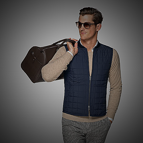 Man wearing a puffer vest in business casual attire