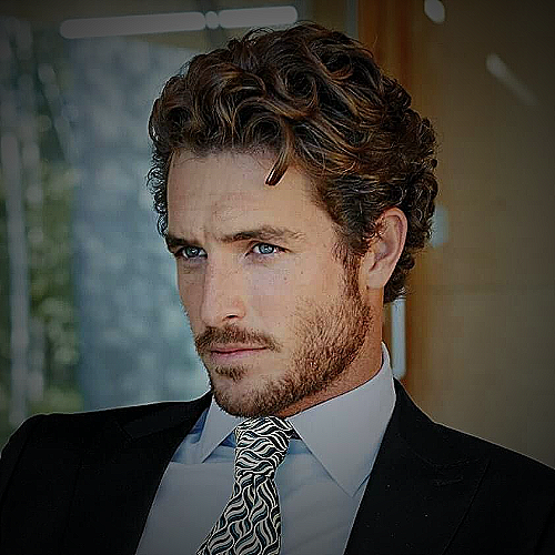 man with curly hair - how to trim curly hair men