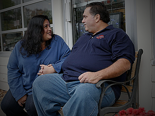 Image of a man and woman having a conversation about weight - do men care about weight