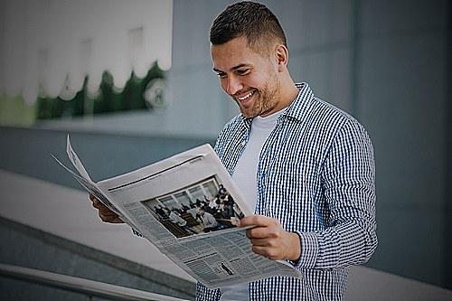 Image of a man reading a newspaper - do men change