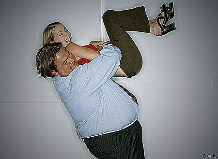 Image of a couple hugging where the man is overweight - do women like fat men