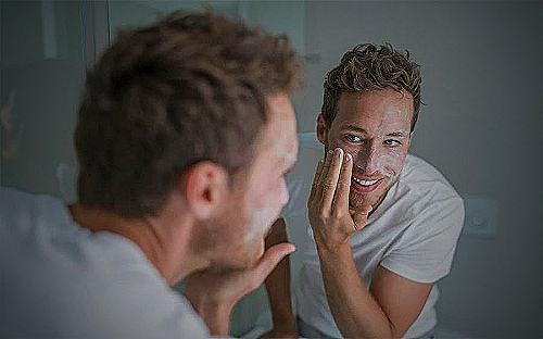 Man cleansing his face - a to z men