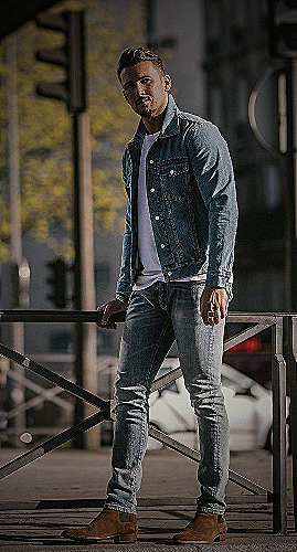 Man wearing light wash jeans with a white t-shirt and white sneakers, perfect for warm weather - how to style light wash jeans mens