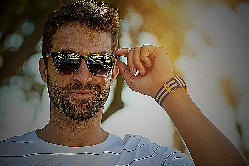 Man wearing sunglasses and watch - what to wear in miami men