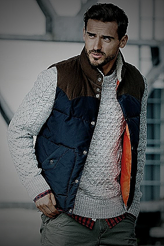 Man wearing a puffer vest outdoors