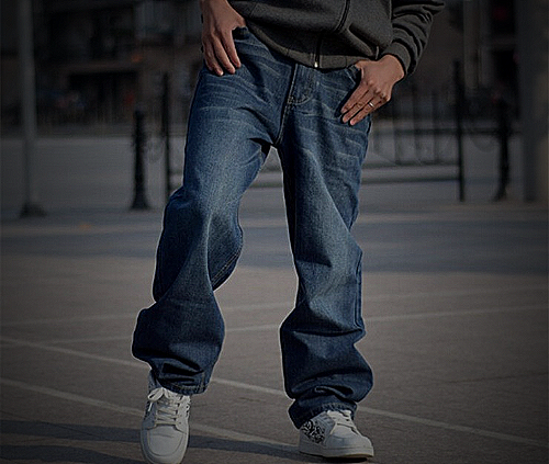 an image of a man wearing sneakers with baggy jeans - what to wear with baggy jeans men