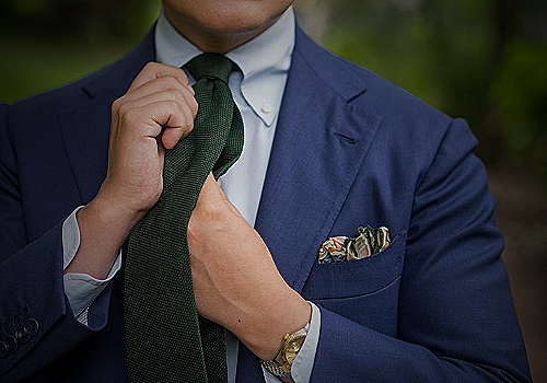 green tie with blue suit
