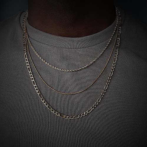man wearing layered necklaces